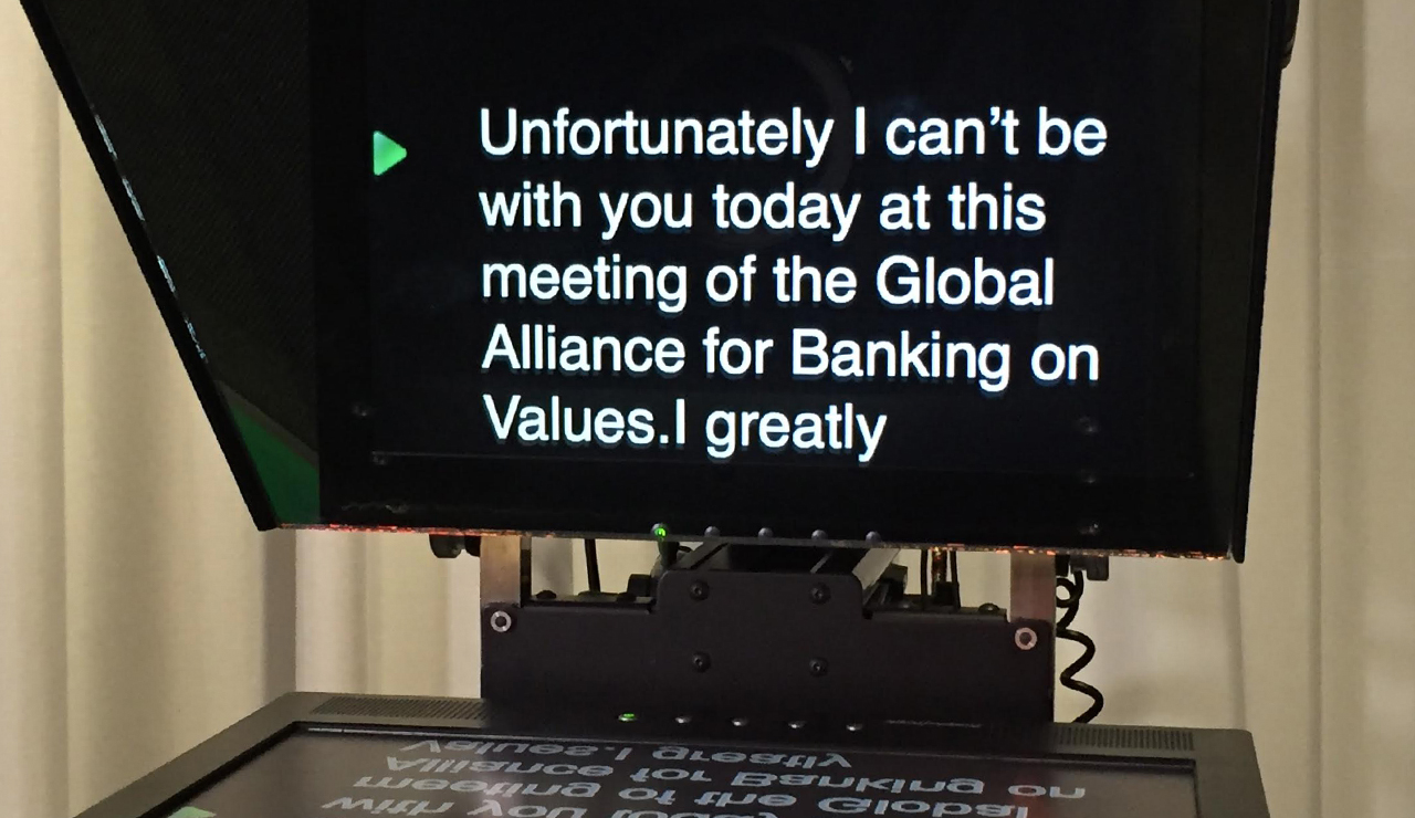 A teleprompter on a camera with the text for the presenter on screen.